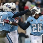 Tennessee Titans running back Chris Johnson (28) is congratulated by quarterback Ryan Fitzpatrick (4) after scoring a touchdown against the Arizona Cardinals on a 25-yard pass play in the first quarter of an NFL football game Sunday, Dec. 15, 2013, in Nashville, Tenn. (AP Photo/Wade Payne)