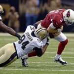 Arizona Cardinals quarterback Carson Palmer (3) is sacked by New Orleans Saints defensive end Cameron Jordan (94) in the first half of an NFL football game in New Orleans, Sunday, Sept. 22, 2013. (AP Photo/Bill Feig)
