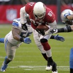 Arizona Cardinals tight end Jeff King (87) breaks the tackle of Detroit Lions middle linebacker Stephen Tulloch (55) during the first half of an NFL football game on Sunday, Dec. 16, 2012, in Glendale, Ariz. (AP Photo/Matt York)
