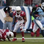Tennessee Titans running back Chris Johnson (28) gets past Arizona Cardinals defenders Karlos Dansby (56) and Rashad Johnson (26) as Chris Johnson scores a touchdown on a 25-yard pass play in the first quarter of an NFL football game Sunday, Dec. 15, 2013, in Nashville, Tenn. (AP Photo/Wade Payne)