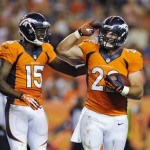 Denver Broncos Tavarres King (15) celebrates with running back Jacob Hester (22) after he scored on a seven-yard run in the third quarter against the Arizona Cardinals during a preseason NFL football game Thursday, Aug. 29, 2013, in Denver. (AP Photo/Jack Dempsey)