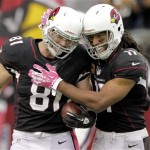Arizona Cardinals tight end Jim Dray (81) celebrates his touchdown with Larry Fitzgerald during the second half of a NFL football game against the Carolina Panthers, Sunday, Oct. 6, 2013, in Glendale, Ariz. The Cardinals won 22-6. (AP Photo/Rick Scuteri)