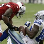 Dallas Cowboys' Dez Bryant (88) has the ball stripped away by Arizona Cardinals' Jerraud Powers for a fumble in the first half during a preseason NFL football game on Saturday, Aug. 17, 2013, in Glendale, Ariz. (AP Photo/Ross D. Franklin)