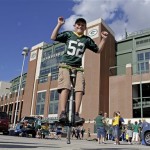 Kevin McGinnity jumps on a pogo stick in the parking lot of Lambeau Field before a preseason NFL football game between the Green Bay Packers and the Arizona Cardinals Friday, Aug. 9, 2013, in Green Bay, Wis. (AP Photo/Tom Lynn)