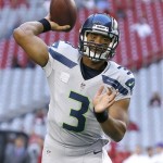 Seattle Seahawks quarterback Russell Wilson warms up for an NFL football game against the Arizona Cardinals, Thursday, Oct. 17, 2013, in Glendale, Ariz. (AP Photo/Ross D. Franklin)
