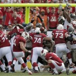 Arizona Cardinals kicker Jay Feely (4) kicks what proved to be a game-winning 27-yard field goal against the Tampa Bay Buccaneers during the fourth quarter of an NFL football game on Sunday, Sept. 29, 2013, in Tampa, Fla. The Cardinals won the game 13-10. (AP Photo/Chris O'Meara)