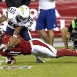 Arizona Cardinals wide receiver Larry Fitzgerald (11) lunges for the extra yards as San Diego Chargers defensive back Johnny Patrick (26) defends during the first half of a preseason NFL football game, Saturday, Aug. 24, 2013, in Glendale, Ariz. (AP Photo/Ross D. Franklin)