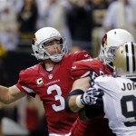 Arizona Cardinals quarterback Carson Palmer (3) passes as New Orleans Saints defensive end Cameron Jordan (94) pressures in the first half of an NFL football game in New Orleans, Sunday, Sept. 22, 2013. (AP Photo/Bill Haber)