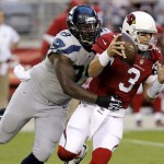Arizona Cardinals quarterback Carson Palmer (3) is sacked by Seattle Seahawks defensive tackle Tony McDaniel (99) during the first half of an NFL football game, Thursday, Oct. 17, 2013, in Glendale, Ariz. (AP Photo/Ross D. Franklin)