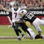 Houston Texans quarterback Case Keenum (7) throws under pressure from Arizona Cardinals defensive end Calais Campbell (93) and Daryl Washington during the first half of an NFL football game Sunday, Nov. 10, 2013, in Glendale, Ariz. (AP Photo/Rick Scuteri)