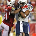 San Diego Chargers wide receiver Malcom Floyd (80) scores a touchdown as Arizona Cardinals cornerback Patrick Peterson (21) defends during the second half of an NFL football game, Monday, Sept. 8, 2014, in Glendale, Ariz. (AP Photo/Rick Scuteri)