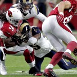 Arizona Cardinals running back Andre Ellington (38) is tackled by St. Louis Rams middle linebacker James Laurinaitis during the first half of an NFL football game, Sunday, Nov. 9, 2014, in Glendale, Ariz. (AP Photo/Ross D. Franklin)
