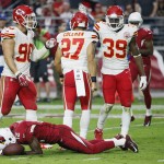 Arizona Cardinals wide receiver John Brown (12) lies on the turf after being hit against the Kansas City Chiefs during the second half of an NFL football game, Sunday, Dec. 7, 2014, in Glendale, Ariz. (AP Photo/Matt York)