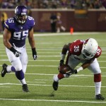  Arizona Cardinals running back Zach Bauman picks up a fumble and scores a touchdown in front of Minnesota Vikings defensive end Scott Crichton, left, during the second half of an NFL preseason football game, Saturday, Aug. 16, 2014, in Minneapolis. The Vikings won 30-28. (AP Photo/Jim Mone)