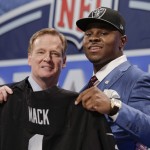 Buffalo linebacker Khalil Mack, right, poses for photos with NFL commissioner Roger Goodell after being selected by the Oakland Raiders as the fifth pick in the first round of the 2014 NFL Draft, Thursday, May 8, 2014, in New York. (AP Photo/Craig Ruttle)