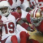 Arizona Cardinals' Ted Ginn (19) is tackled by San Francisco 49ers defensive back L.J. McCray (31) after returning a kickoff during the first quarter of an NFL football game in Santa Clara, Calif., Sunday, Dec. 28, 2014. (AP Photo/Tony Avelar)
