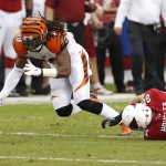  Arizona Cardinals tight end Rob Housler (84) can't make the catch as Cincinnati Bengals linebacker Emmanuel Lamur, left, defends during the first half of an NFL preseason football game, Sunday, Aug. 24, 2014, in Glendale, Ariz. (AP Photo/Ross D. Franklin)