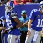 New York Giants quarterback Eli Manning (10) and Rueben Randle (82) celebrate after they connected for a touchdown during the first half of an NFL football game against the Arizona Cardinals, Sunday, Sept. 14, 2014, in East Rutherford, N.J. (AP Photo/Bill Kostroun)