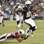 San Diego Chargers wide receiver Seyi Ajirotutu escapes from Arizona Cardinals defensive back Bryan McCann during the first half of an NFL preseason football game Thursday, Aug. 28, 2014, in San Diego. (AP Photo/Denis Poroy)
