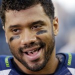 Seattle Seahawks quarterback Russell Wilson (3) smiles after an NFL football game against the Arizona Cardinals, Sunday, Nov. 23, 2014, in Seattle. The Seahawks won 19-3. (AP Photo/Elaine Thompson)