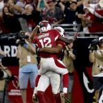 Arizona Cardinals wide receiver John Brown (12) celebrates his touchdown with teammate Larry Fitzgerald during the second half of an NFL football game against the St. Louis Rams, Sunday, Nov. 9, 2014, in Glendale, Ariz. (AP Photo/Ross D. Franklin)