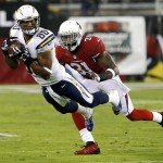 San Diego Chargers wide receiver Malcom Floyd (80) pulls in a pass as Arizona Cardinals cornerback Antonio Cromartie (31) defends during the first half of an NFL football game, Monday, Sept. 8, 2014, in Glendale, Ariz. (AP Photo/Rick Scuteri)