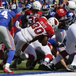 Arizona Cardinals running back Jonathan Dwyer (20) rushes for a touchdown during the first half of an NFL football game against the New York Giants, Sunday, Sept. 14, 2014, in East Rutherford, N.J. (AP Photo/Kathy Willens)