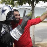 Dallas Cowboys fan Vance Nickelson, left, poses for a photo with an unidentified fan before the Cowboys and Arizona Cardinals NFL football game Sunday, Nov. 2, 2014, in Arlington, Texas. (AP Photo/Tim Sharp)