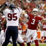 Arizona Cardinals quarterback Carson Palmer (3) throws as Houston Texans nose tackle Jerrell Powe (95) defends during the first half of an NFL preseason football game, Saturday, Aug. 9, 2014, in Glendale, Ariz. (AP Photo/Ross D. Franklin)