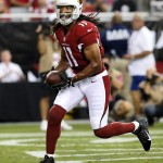Arizona Cardinals wide receiver Larry Fitzgerald scores a touchdown against the Houston Texans during the first half of an NFL preseason football game, Saturday, Aug. 9, 2014, in Glendale, Ariz. (AP Photo/Ross D. Franklin)