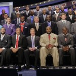 Former NFL players representing all 32 teams in the league gather on stage before the start of the second round of the 2014 NFL Draft, Friday, May 9, 2014, in New York. (AP Photo/Jason Decrow)
