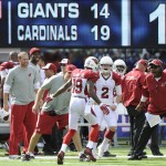 Arizona Cardinals wide receiver Ted Ginn (19) celebrates with teammates after scoring a touchdown on a 71-yard punt return during the second half of an NFL football game Sunday, Sept. 14, 2014, in East Rutherford, N.J. (AP Photo/Bill Kostroun)