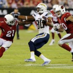 San Diego Chargers wide receiver Malcom Floyd (80) is pursued by Arizona Cardinals inside linebacker Larry Foote (50) and Patrick Peterson (21) during the second half of an NFL football game, Monday, Sept. 8, 2014, in Glendale, Ariz. (AP Photo/Rick Scuteri)