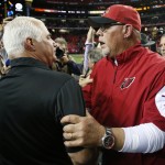 Atlanta Falcons head coach Mike Smith left, speaks with Arizona Cardinals head coach Bruce Arians after the second half of an NFL football game, Sunday, Nov. 30, 2014, in Atlanta. The Atlanta Falcons won 29-18. (AP Photo/John Bazemore)