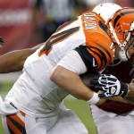 Cincinnati Bengals quarterback Andy Dalton (14) is sacked by Arizona Cardinals defensive end Calais Campbell during the first half of an NFL preseason football game, Sunday, Aug. 24, 2014, in Glendale, Ariz. (AP Photo/Ross D. Franklin)