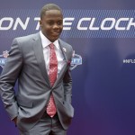 Louisville quarterback Teddy Bridgewater poses for photos upon arriving for the first round of the 2014 NFL Draft at Radio City Music Hall, Thursday, May 8, 2014, in New York. (AP Photo/Craig Ruttle)