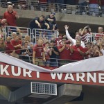 Fans unveil former Arizona Cardinals quarterback Kurt Warner's name as he is inducted into the Cardinals' ring of honor at halftime during an NFL football game against the San Diego Chargers, Monday, Sept. 8, 2014, in Glendale, Ariz. (AP Photo/Rick Scuteri)