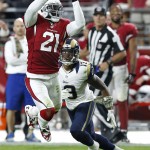 Arizona Cardinals cornerback Patrick Peterson (21) intercepts a pass intended for St. Louis Rams wide receiver Chris Givens (13) during the second half of an NFL football game, Sunday, Nov. 9, 2014, in Glendale, Ariz. (AP Photo/Ross D. Franklin)
