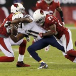 Arizona Cardinals cornerback Jerraud Powers (25) and Antonio Cromartie break up a pass intended for San Diego Chargers wide receiver Eddie Royal (11) during the first half of an NFL football game, Monday, Sept. 8, 2014, in Glendale, Ariz. (AP Photo/Rick Scuteri)