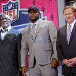 Minnesota defensive tackle Ra'Shede Hageman, center, poses for photos with NFL commissioner Roger Goodell, right, and former NFL player Claude Humphrey after being selected by the Atlanta Falcons as the 37th pick during the second round of the 2014 NFL Draft, Friday, May 9, 2014, in New York. (AP Photo/Jason DeCrow)