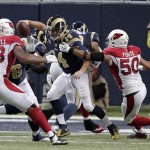 St. Louis Rams quarterback Shaun Hill (14) is sacked by Arizona Cardinals' Larry Foote (50) during the second half of an NFL football game Thursday, Dec. 11, 2014 in St. Louis. (AP Photo/Tom Gannam)