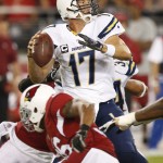 San Diego Chargers quarterback Philip Rivers (17) throws under pressure against the Arizona Cardinals during the first half of an NFL football game, Monday, Sept. 8, 2014, in Glendale, Ariz. (AP Photo/Ross D. Franklin)