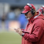 Arizona Cardinals head coach Bruce Arians looks at his play card in the second half of an NFL football game against the Seattle Seahawks, Sunday, Nov. 23, 2014, in Seattle. The Seahawks beat the Cardinals 19-3. (AP Photo/Stephen Brashear)