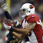Arizona Cardinals wide receiver Michael Floyd (15) makes a catch against St. Louis Rams' Janoris Jenkins (21) during the first half of an NFL football game Thursday, Dec. 11, 2014 in St. Louis. (AP Photo/Jeff Roberson)