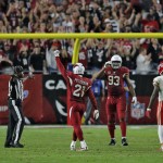Arizona Cardinals' Patrick Peterson (21) celebrates a final turn over on downs before time expires during the second half of an NFL football game against the Kansas City Chiefs, Sunday, Dec. 7, 2014, in Glendale, Ariz. The Cardinals won 17-14 to improve to 10-3. (AP Photo/Rick Scuteri)