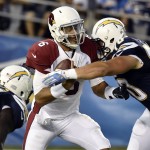 Arizona Cardinals quarterback Logan Thomas, center, is sacked by San Diego Chargers defensive tackle Chas Alecxih, right, during the first half of an NFL preseason football game Thursday, Aug. 28, 2014, in San Diego. (AP Photo/Denis Poroy)