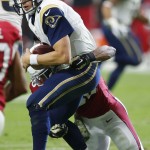 St. Louis Rams' Austin Davis, left, gets sacked by Arizona Cardinals' Deone Bucannon, right, during the first half of an NFL football game Sunday, Nov. 9, 2014, in Glendale, Ariz. (AP Photo/Ross D. Franklin)