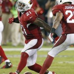 Arizona Cardinals' Patrick Peterson (21) and Rashad Johnson, right, celebrate a defensive stop on the the San Diego Chargers final possession during the second half of an NFL football game Monday, Sept. 8, 2014, in Glendale, Ariz. The Cardinals won 18-17. (AP Photo/Ross D. Franklin)