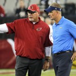 Arizona Cardinals head coach Bruce Arians, left, and San Diego Chargers head coach Mike McCoy talk prior to an NFL football game, Monday, Sept. 8, 2014, in Glendale, Ariz. (AP Photo/Matt York)