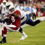 Arizona Cardinals running back Andre Ellington (38) is tackled by San Diego Chargers outside linebacker Melvin Ingram during the second half of an NFL football game, Monday, Sept. 8, 2014, in Glendale, Ariz. (AP Photo/Ross D. Franklin)
